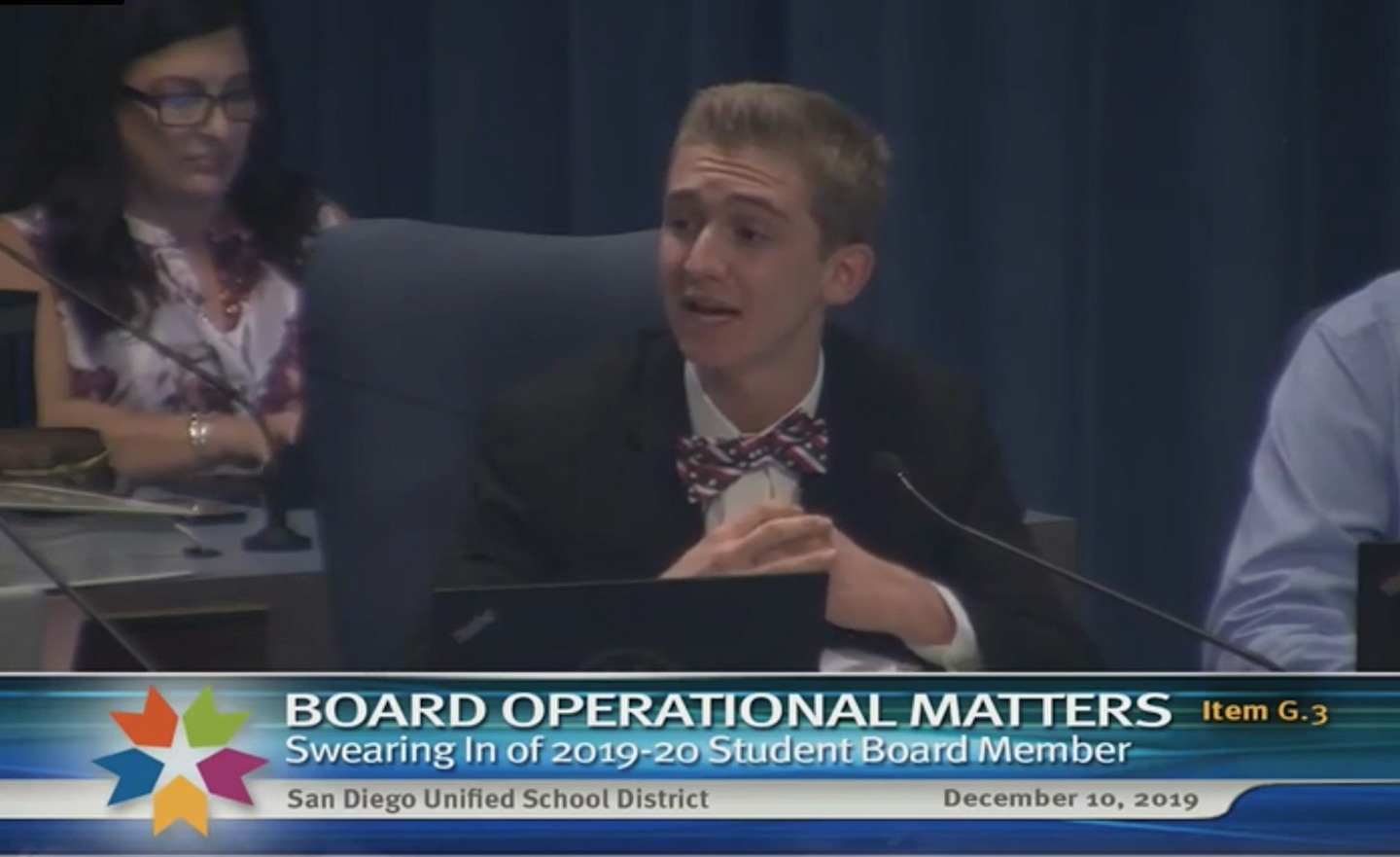 Zachary speaking at a San Diego school board meeting.