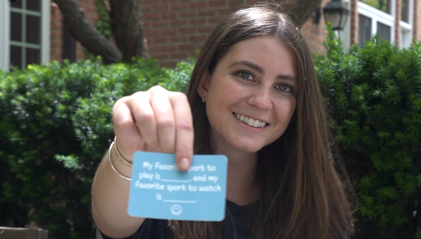 Hannah holding up one of her Question Connection cards.
