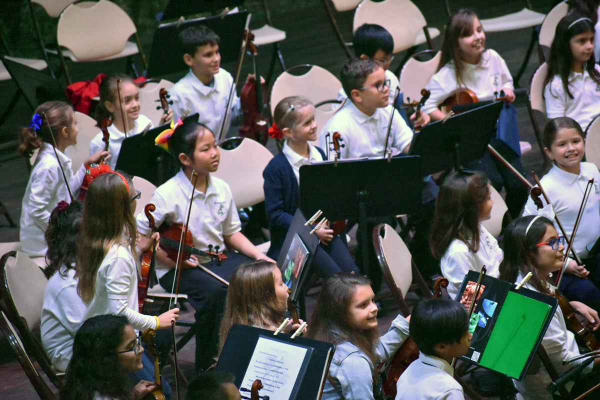 Photo of an elementary school violin section.