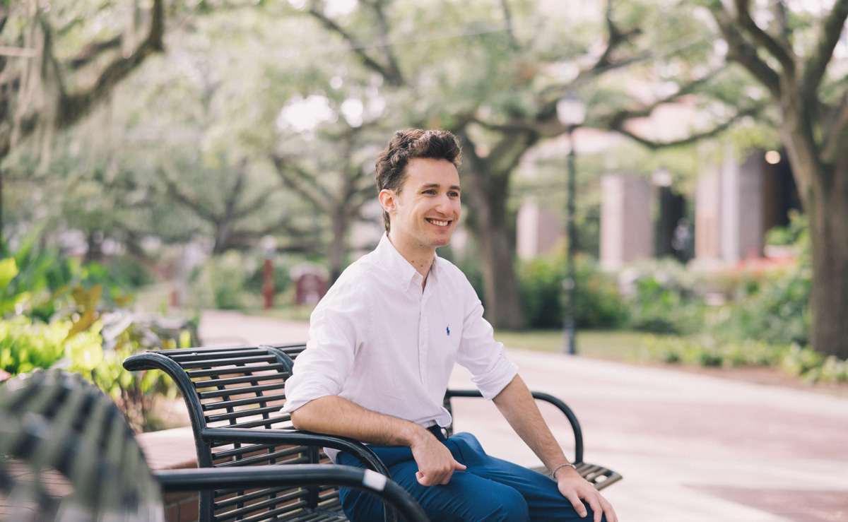 Jonathan Tamen poses on a park bench